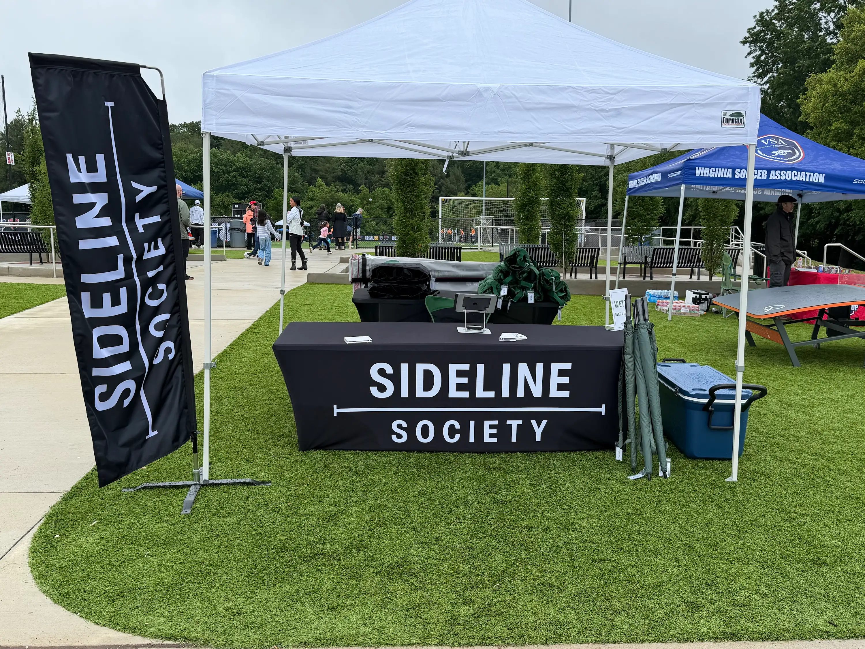 Sideline Society sideline setup with tent, chairs, and cooler at Cannon Cup 2026 in Leesburg, VA