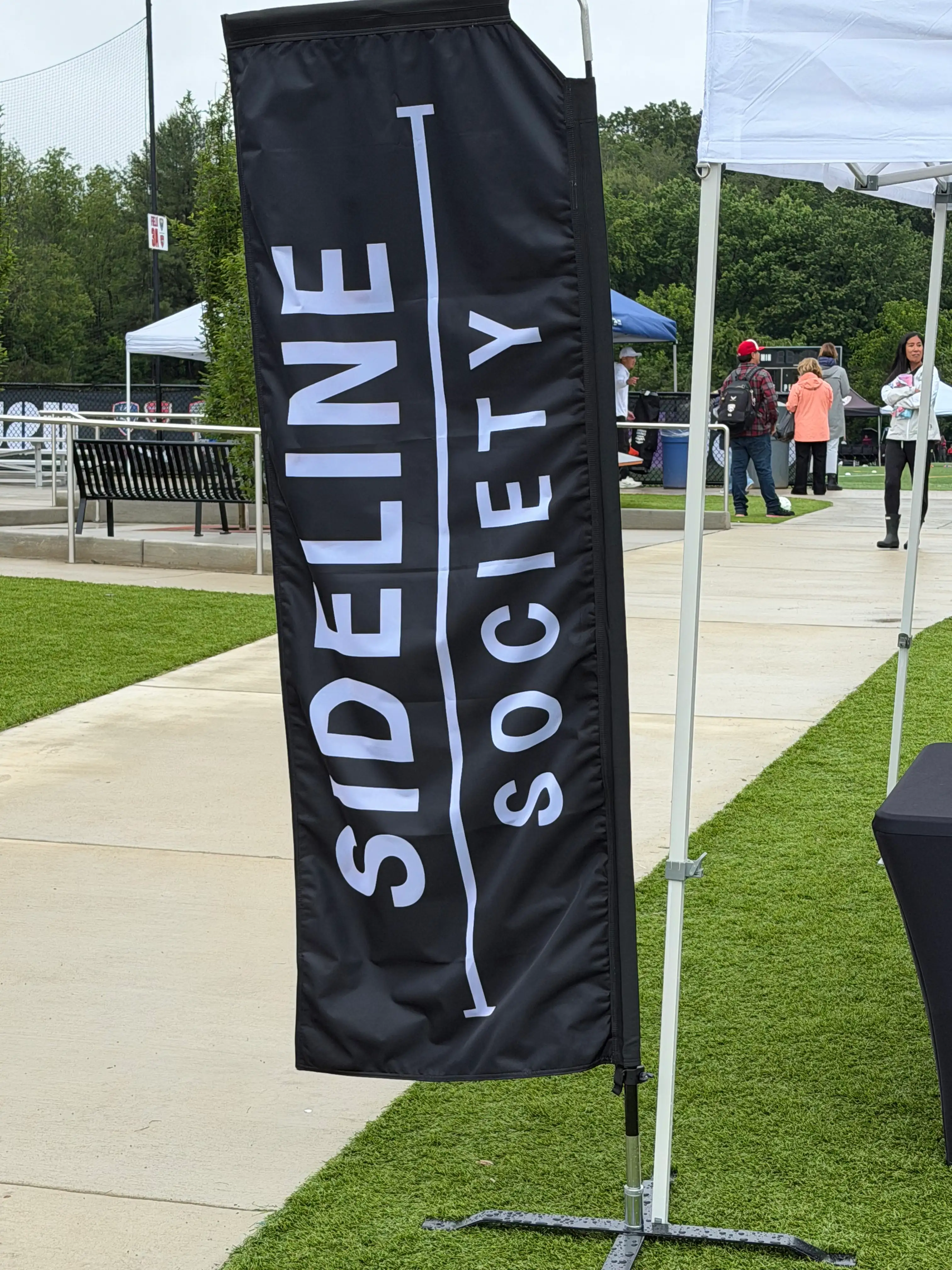 Sideline Society branded signage at the Cannon Cup 2026 VSA youth soccer tournament